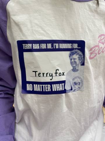 t shirt with a "running for Terry Fox" sticker on it